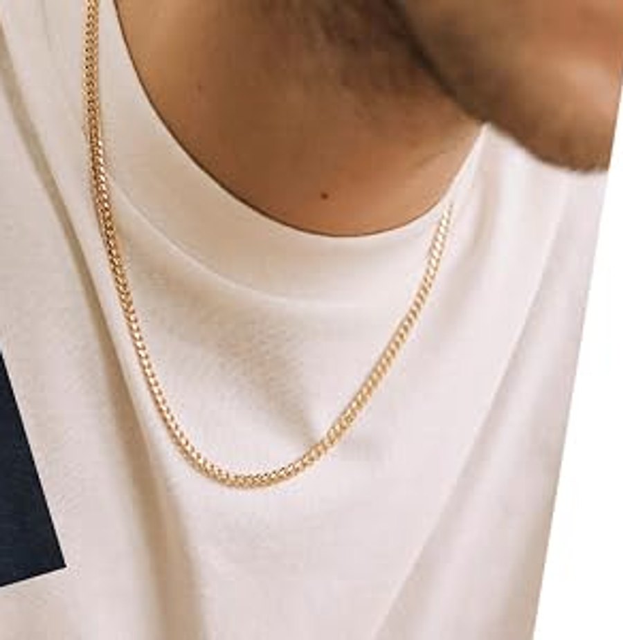 Cuban link chain worn over a plain tee